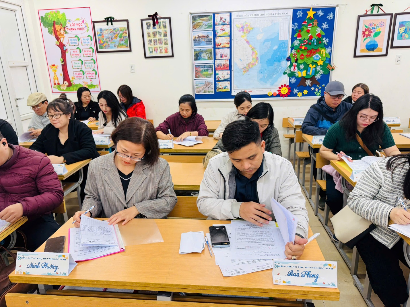 A group of people sitting at desks in a classroom

AI-generated content may be incorrect.