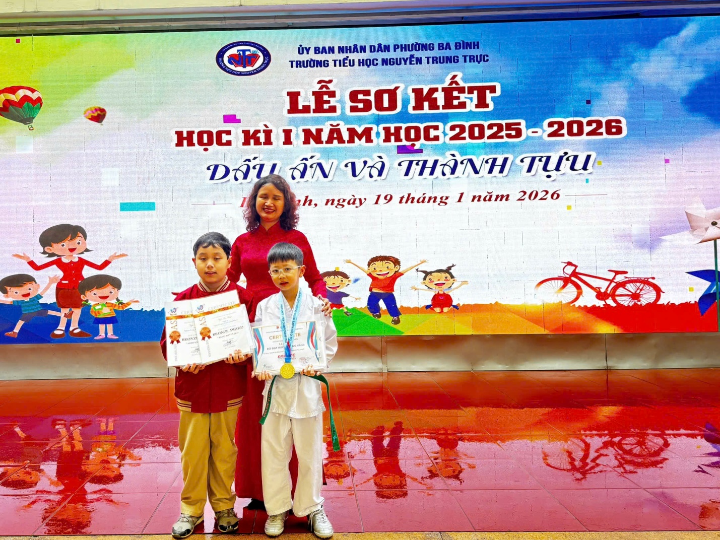 A person and two boys posing for a photo

AI-generated content may be incorrect.