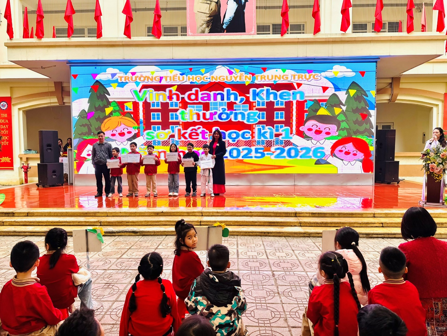 A group of children on a stage

AI-generated content may be incorrect.