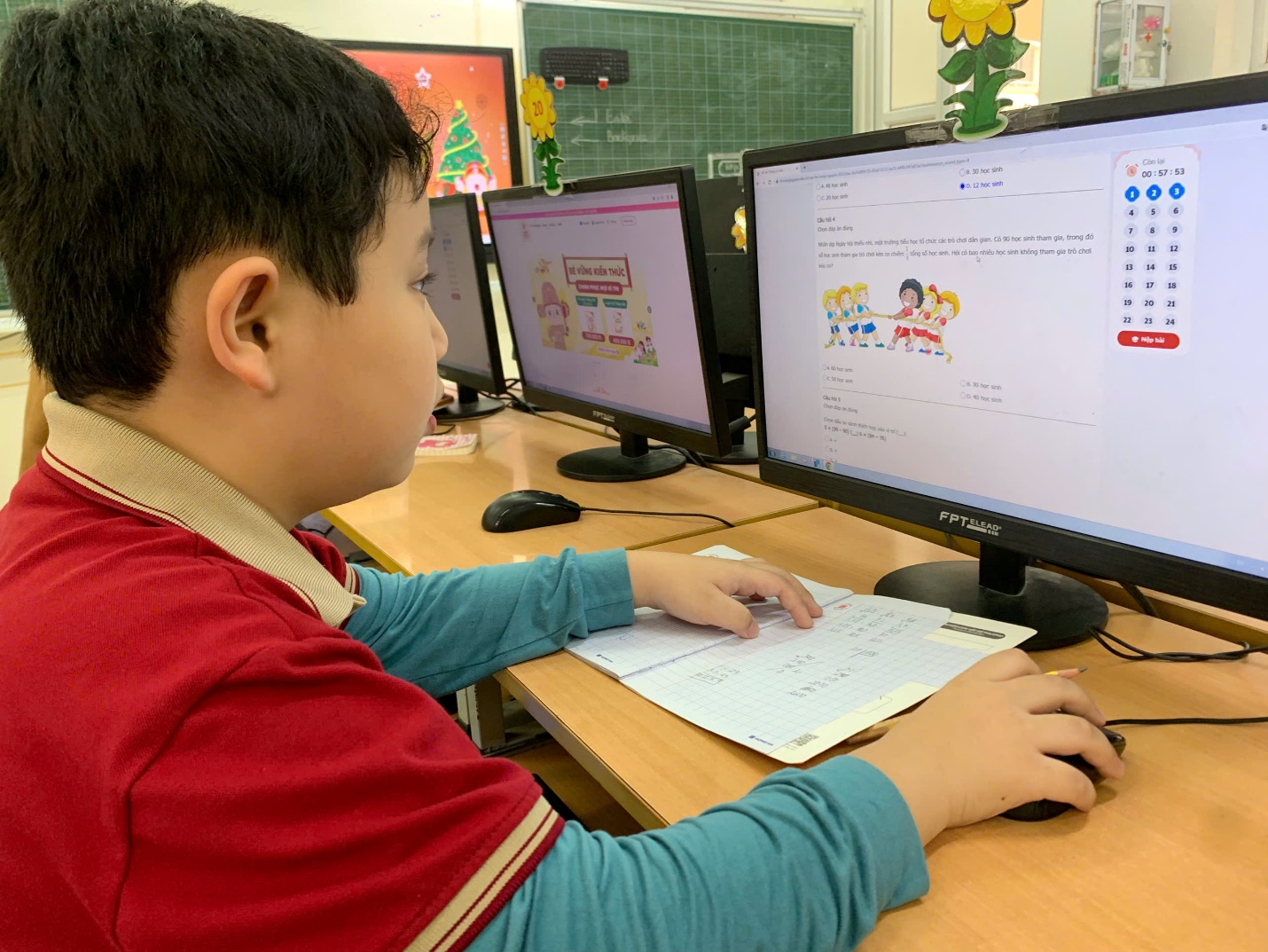 A child sitting at a desk using a computer

AI-generated content may be incorrect.
