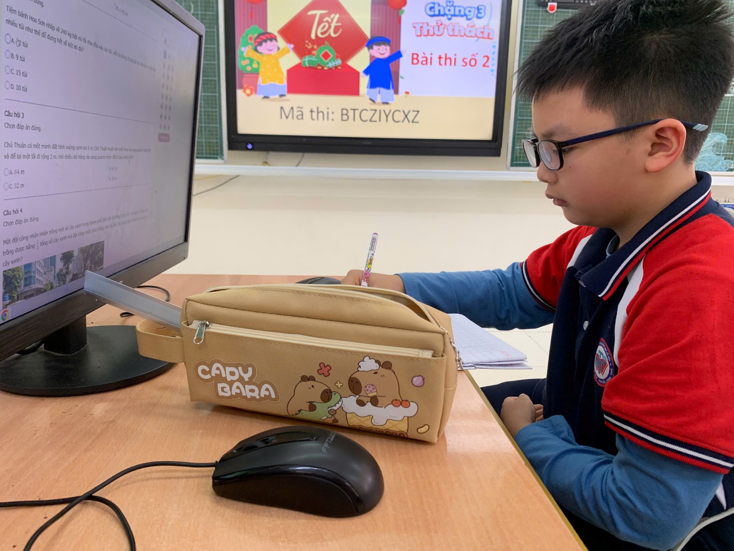 A child sitting at a desk with a computer

AI-generated content may be incorrect.