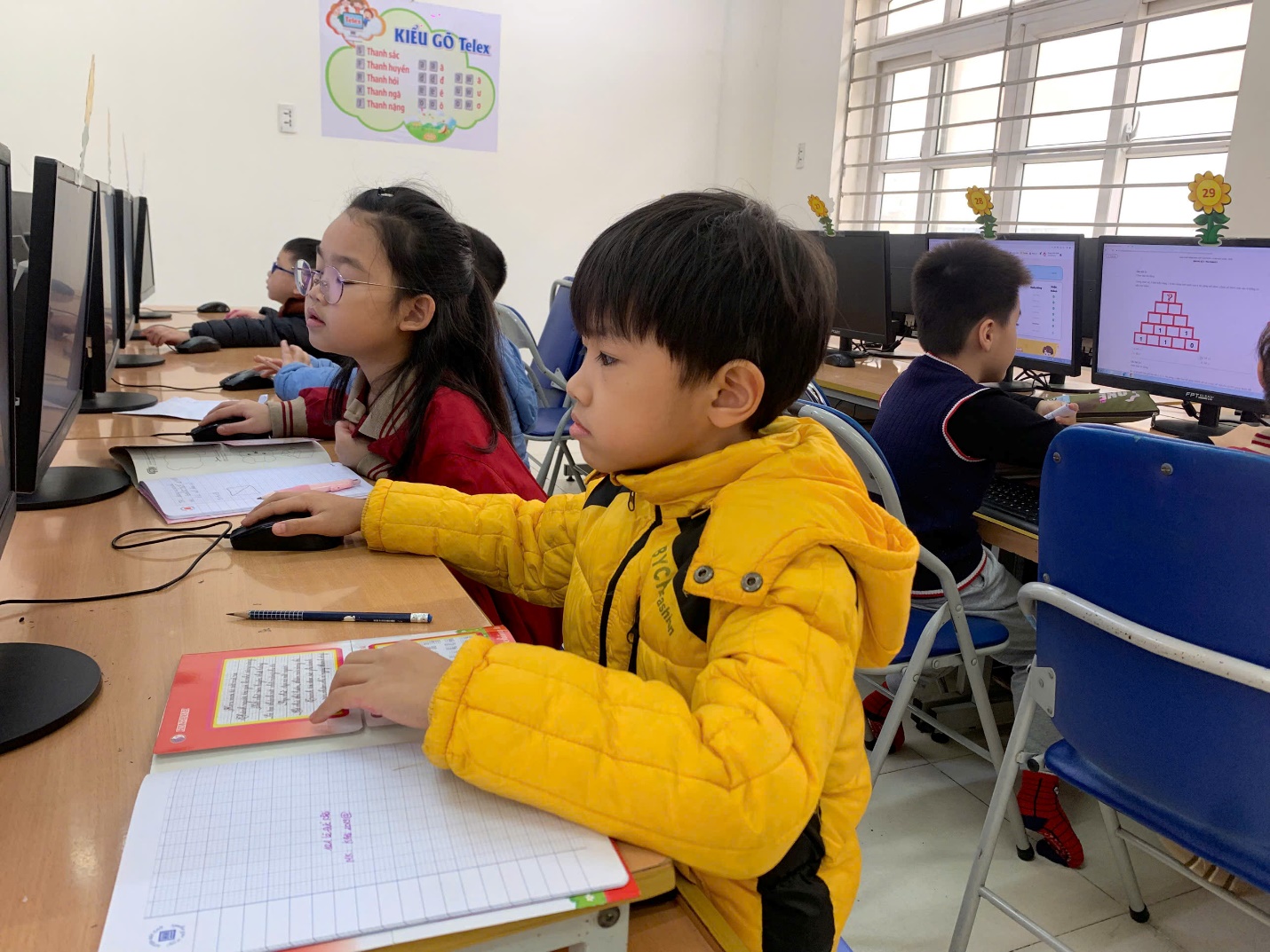 A group of children sitting at desks in a classroom

AI-generated content may be incorrect.