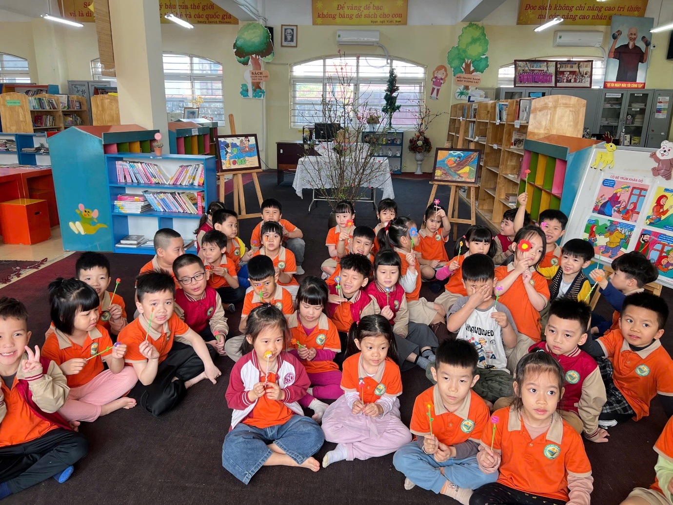 A group of children sitting on the floor in a classroom

AI-generated content may be incorrect.