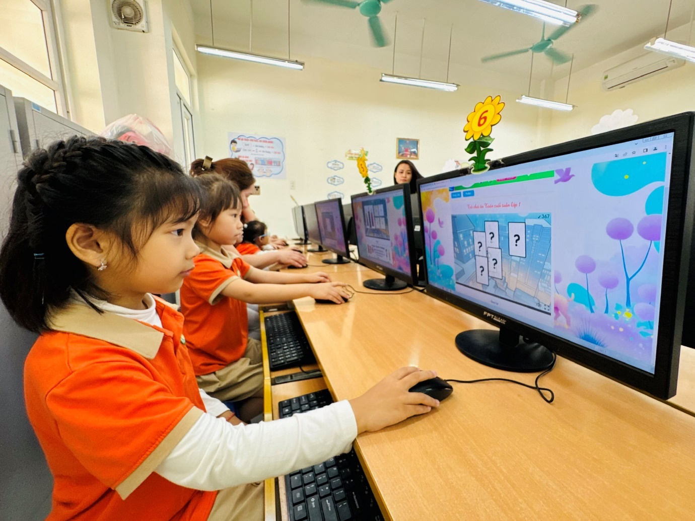 A group of children using computers

AI-generated content may be incorrect.