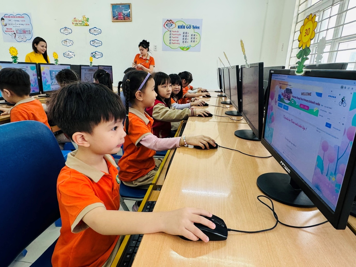 A group of children using computers

AI-generated content may be incorrect.