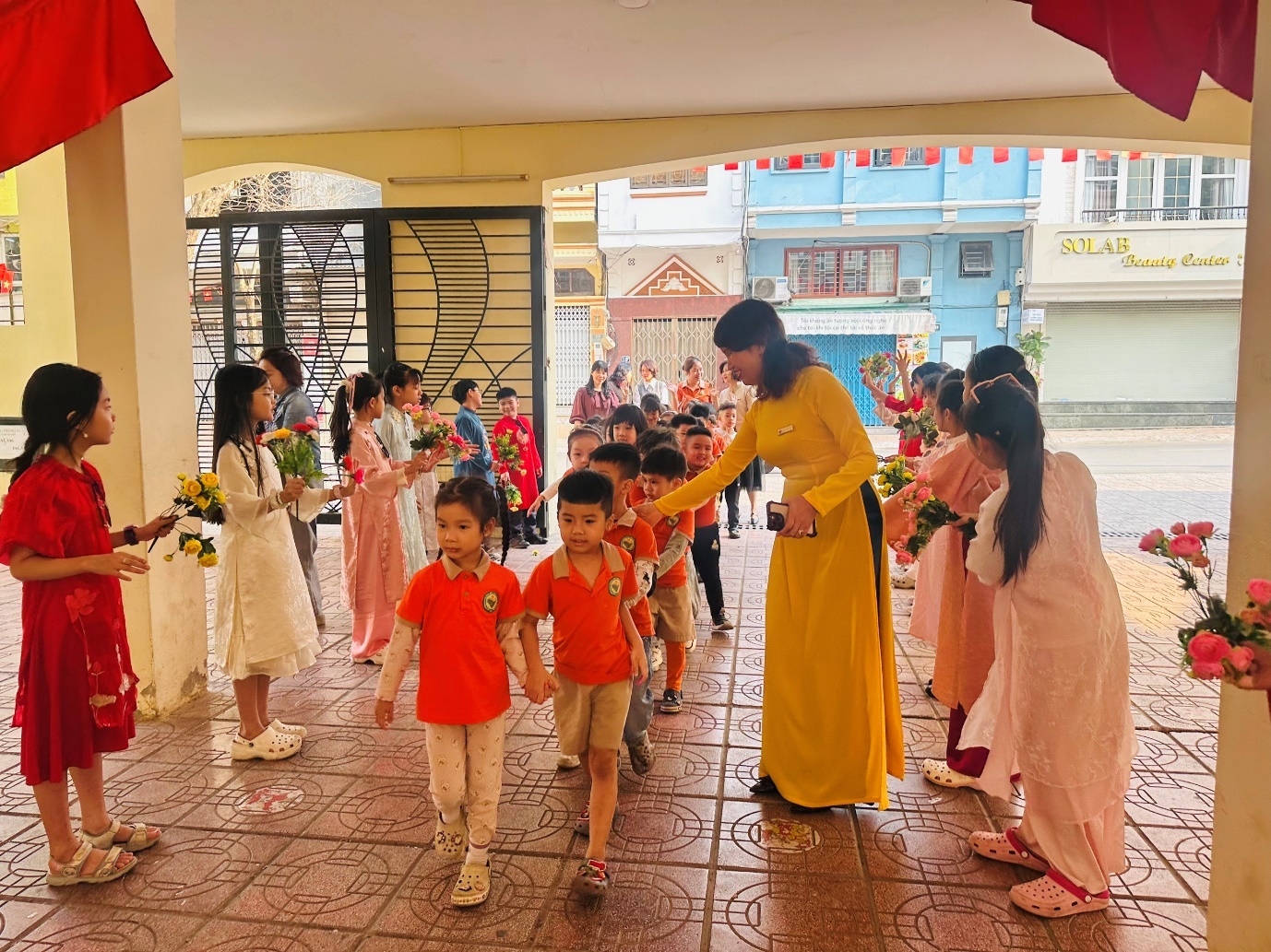 A group of children and a person in yellow dress

AI-generated content may be incorrect.