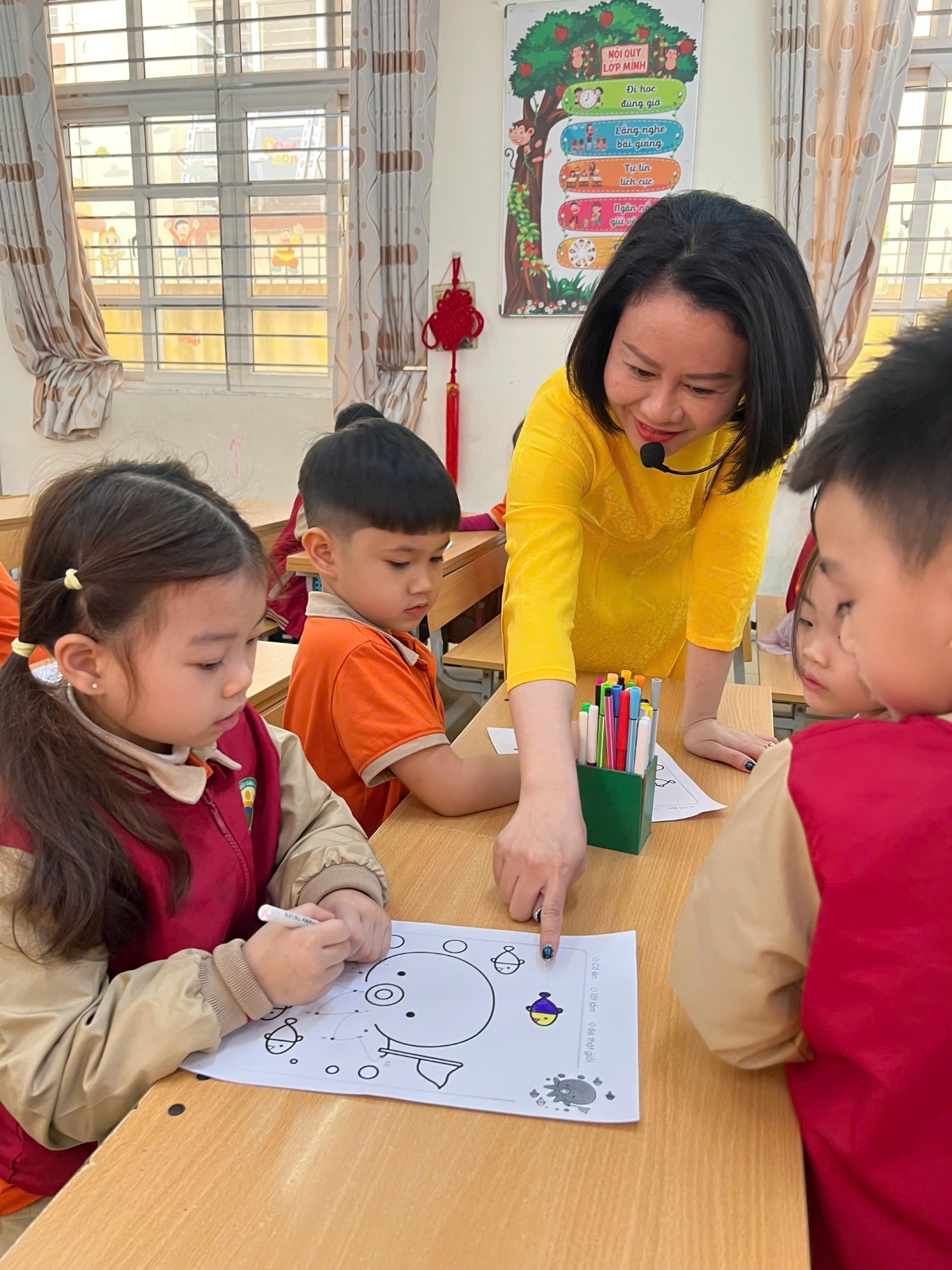 A person teaching children coloring

AI-generated content may be incorrect.