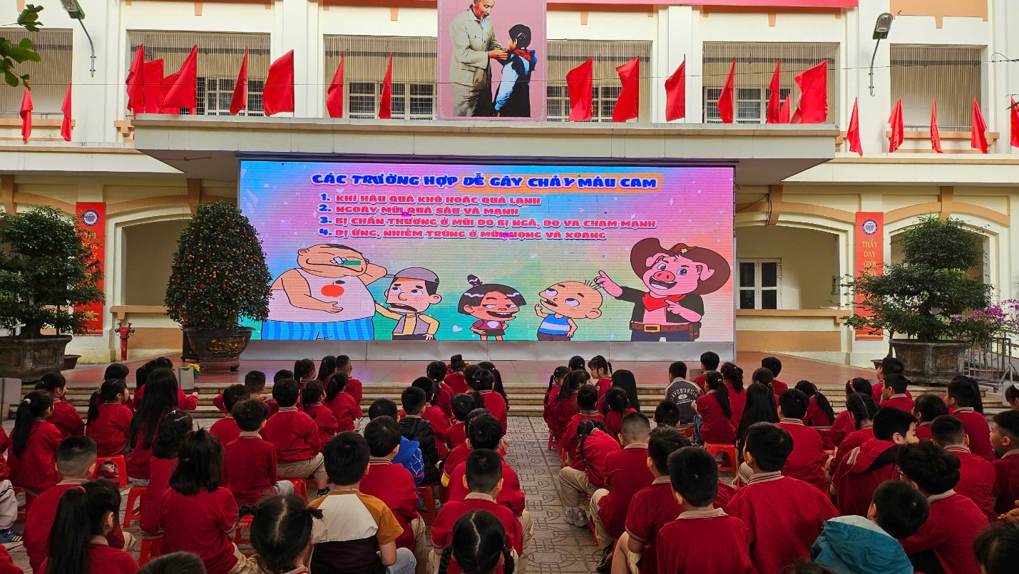 A group of people in front of a large screen

AI-generated content may be incorrect.