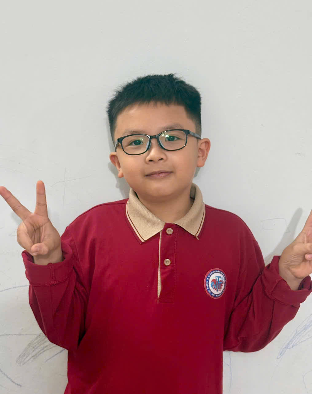 A child wearing glasses and a red shirt

AI-generated content may be incorrect.